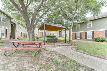 Covered smoking area with picnic table and benches